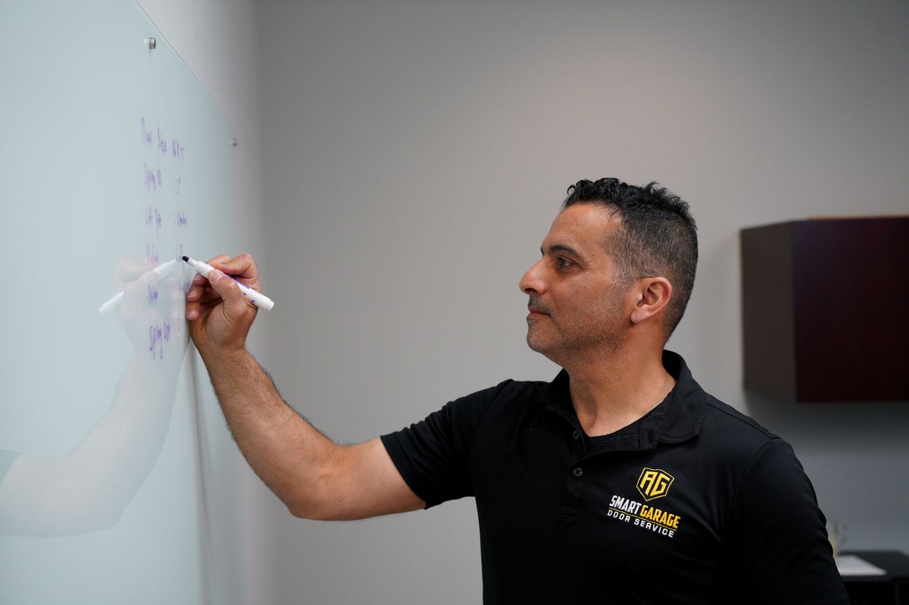 Adi Gaber working through a problem at the whiteboard